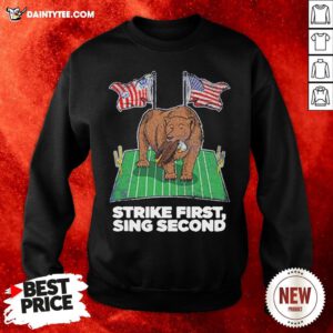 - Design By Daintytee.comOriginal Strike First Sing Second Flag US Sweatshirt