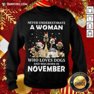 Never Underestimate A Woman Who Loves Dogs And Was Born In November Christmas Sweatshirt- Design By Daintytee.com