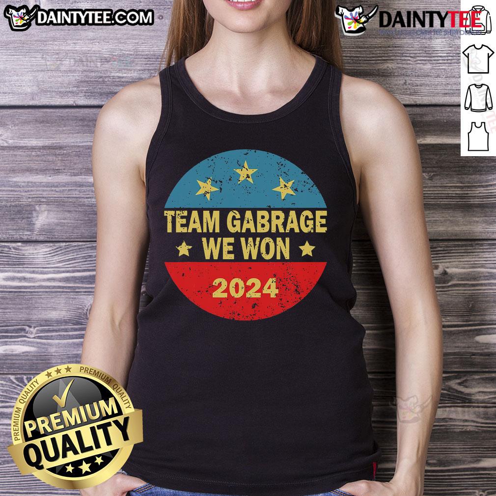 Awesome Team wearing 'Team Garbage For Trump 2024' tank tops, celebrating their support for the elections.