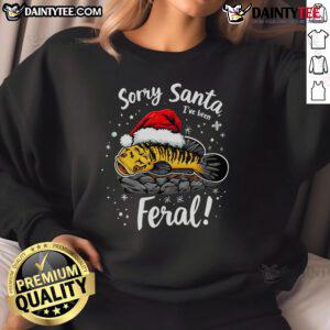 Funny Northern Snakehead sweatshirt with 'Sorry Santa, I've Been Feral' design for a humorous Christmas vibe.
