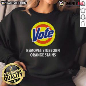 Funny Vote Removes Stubborn Orange Stains Anti-Trump Sweatshirt featuring a humorous design for political satire fans.