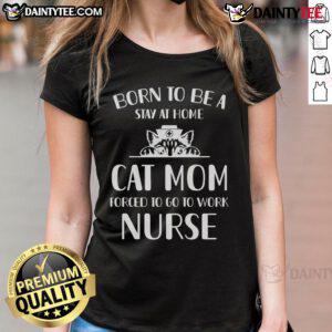 Stay-at-home cat forced to work, wearing a nurse-themed tee, showcasing humor and love for cats in a playful design.