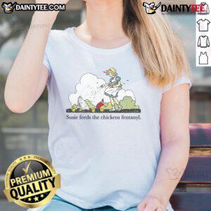 Cute Susie feeds a chicken in a playful scene, showcasing the 'Fentanyl Ladies Tee' design for animal lovers.