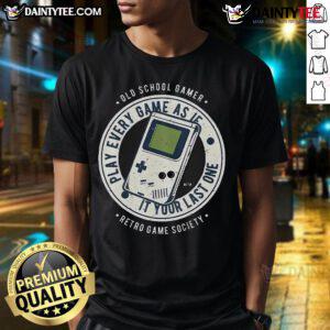 Awesome old school gamer wearing a retro T-shirt that says 'Play Every Game As If It's Your Last One' in vibrant colors.