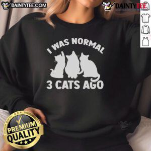 Funny 'I Was Normal 3 Cats Ago' sweatshirt featuring playful kittens, perfect for cat lovers and cozy fashion enthusiasts.
