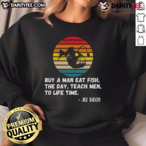 Funny Joe Biden sweatshirt with retro sunset design, featuring 'Buy a man a fish' quote. Perfect for casual wear!