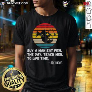 Funny Joe Biden T-shirt with retro sunset design: 'Buy a man a fish, teach a man to fish' slogan.