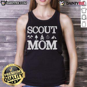 Good Scout Mom in a camping setting, wearing a tank top, proudly supporting her scouting troop.
