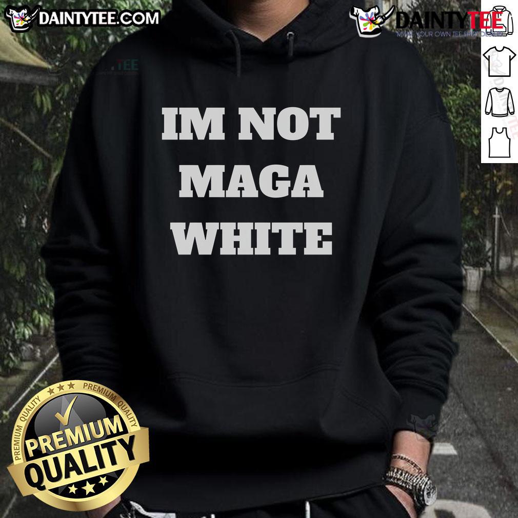 Person wearing a 'Hot I'm Not MAGA' white hoodie, showcasing a bold political statement in casual fashion.