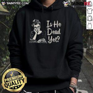 Trendy Hot Is He Dead Yet Hoodie in black, showcasing unique graphic design for casual streetwear style.