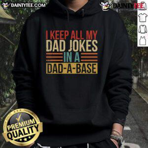 Man wearing a 'Nice, I Keep All My Dad Jokes In A Dadabase' hoodie, showcasing humor and dad joke culture.