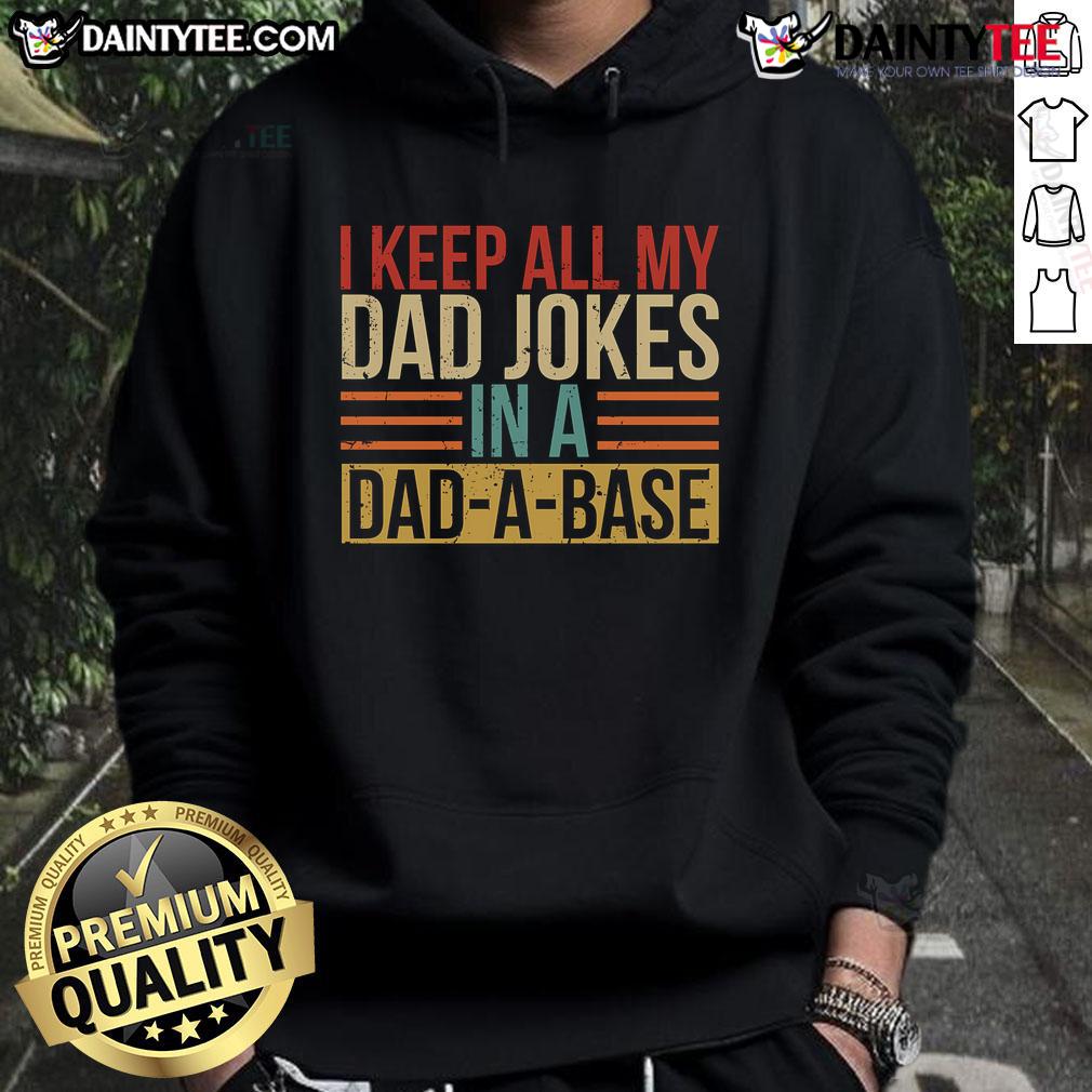 Man wearing a 'Nice, I Keep All My Dad Jokes In A Dadabase' hoodie, showcasing humor and dad joke culture.