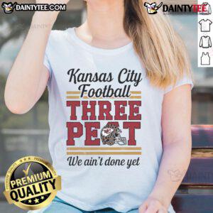 Alt Text: Kansas City Chiefs 'Three-Peat' leopard ladies tee featuring a football helmet design, perfect for fans.