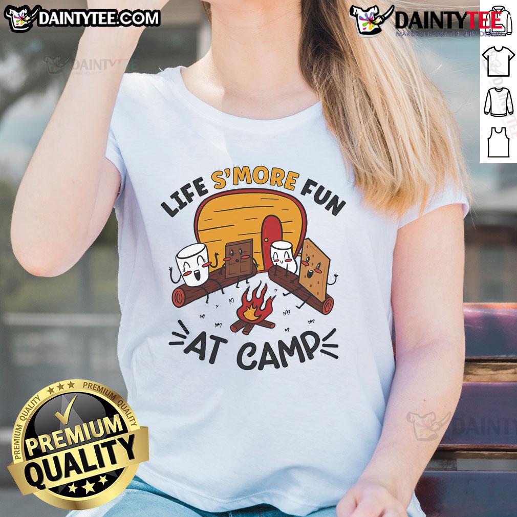 Women in 'Nice Life's More Fun at Camp' tee roasting marshmallows by a campfire, enjoying a fun camping experience.