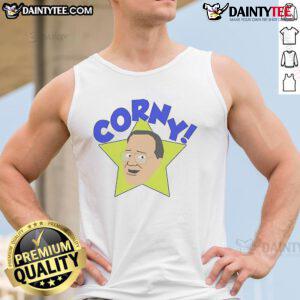 Jim Cornette wearing a funny Arcadian Vanguard tank top, showcasing his unique wrestling humor and style.