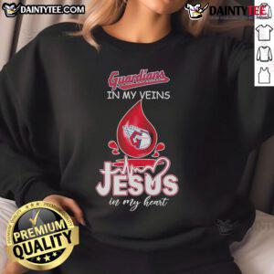 Good Cleveland Guardians in My Veins Jesus in My Heart sweatshirt displayed on a hanger, perfect for fans.