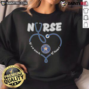 Alt Text: Good Houston Astros Nurse It's A Work of Heart sweatshirt featuring team colors and a heart design for fans.