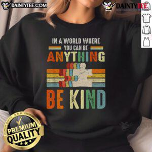 Vintage retro sweatshirt featuring 'Good In A World Where You Can Be Anything, Be Kind' motivational quote design.
