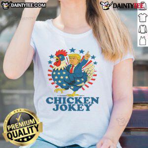 Funny chicken jockey Trump trending ladies tee featuring a humorous design of a chicken riding a mini Trump.