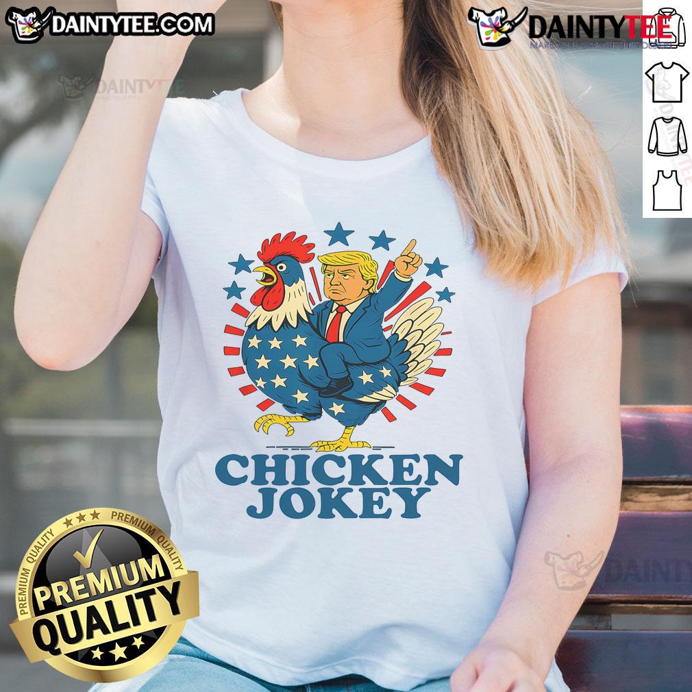 Funny chicken jockey Trump trending ladies tee featuring a humorous design of a chicken riding a mini Trump.