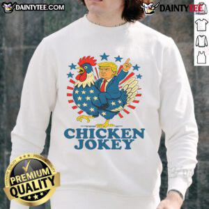 Funny Chicken Jockey Trump Trending Sweatshirt featuring a whimsical chicken riding a jockey in vibrant colors.