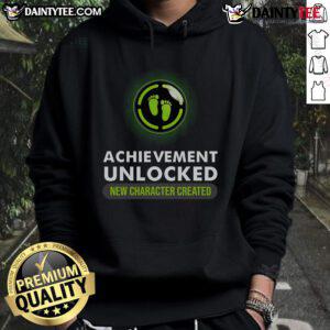 Funny pregnant announcement hoodie featuring Achievement Unlocked: New Character Created for gamers celebrating parenthood.
