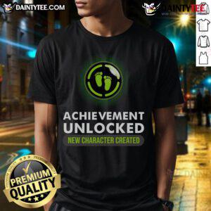 Funny pregnant announcement t-shirt featuring 'Achievement Unlocked: New Character Created' for gamers.