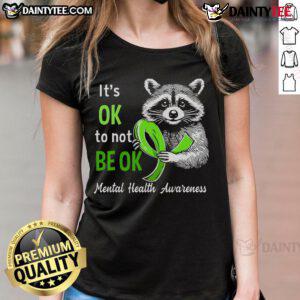 Funny raccoon graphic on a ladies' tee with It's Okay To Not Be Okay slogan for mental health awareness.