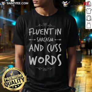 Alt Text: Funny sarcastic saying t-shirt design: 'Fluent in Sarcasm and Cuss Words' in bold, playful typography.