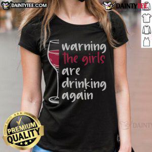 Alt Text: Funny warning graphic on a wine glass tee for ladies, stating They Are Drinking Again, perfect for wine lovers.
