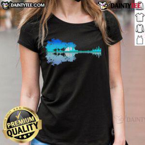 Good Guitar Lake Shadow: A musician playing guitar in nature, perfect for ladies who love music and outdoor adventures.