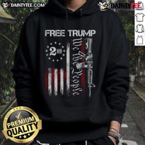 Hot Free Trump Supporter wearing Pro-Trump We The People American Flag Hoodie at a rally, showcasing patriotic style.