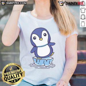 Cute penguin standing on an ice floe, featured on a ladies tee, perfect for animal lovers and winter fashion.