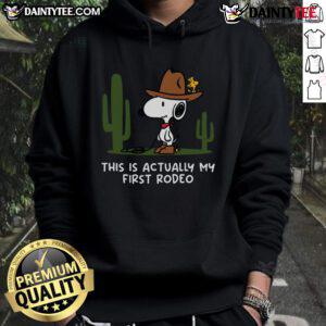 Cute Snoopy hoodie with 'This Is Actually My First Rodeo' text, perfect for fans of Snoopy and casual wear.