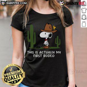 Cute Snoopy 'This Is Actually My First Rodeo' ladies tee featuring a playful design and vibrant colors.