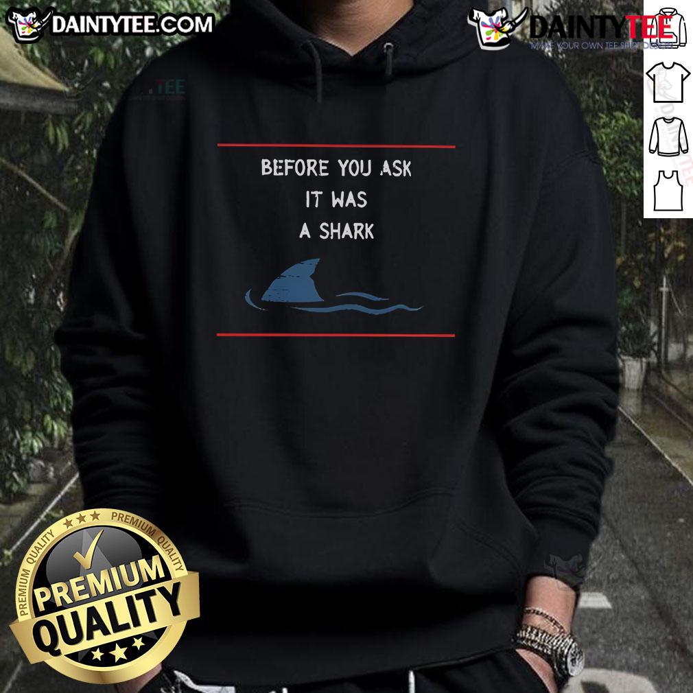 Person wearing a funny shark hoodie, smiling at the camera, showcasing a playful design and vibrant colors.