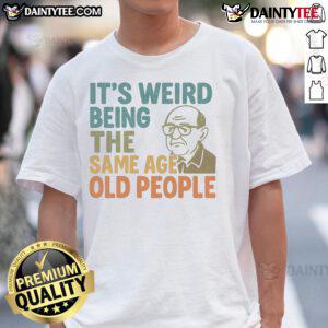 Alt Text: Funny It's Weird Being The Same Age As Old People T-Shirt design featuring humorous text and vibrant colors.
