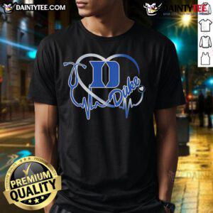 Alt Text: Good Duke Blue Devils Caring Heartbeat Nurse T-Shirt featuring a heart and pulse design for proud nurses and fans.
