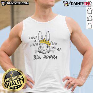 Man wearing a 'Good I Love It When You Call Me Big Hoppa' tank top, showcasing a trendy streetwear style.