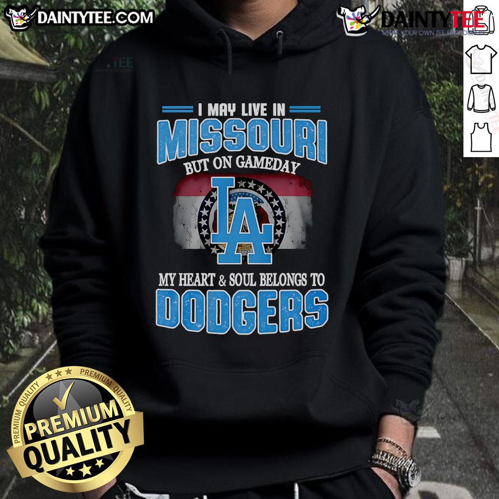 Person wearing Dodgers hoodie, showcasing pride for the team while living in Missouri on game day.