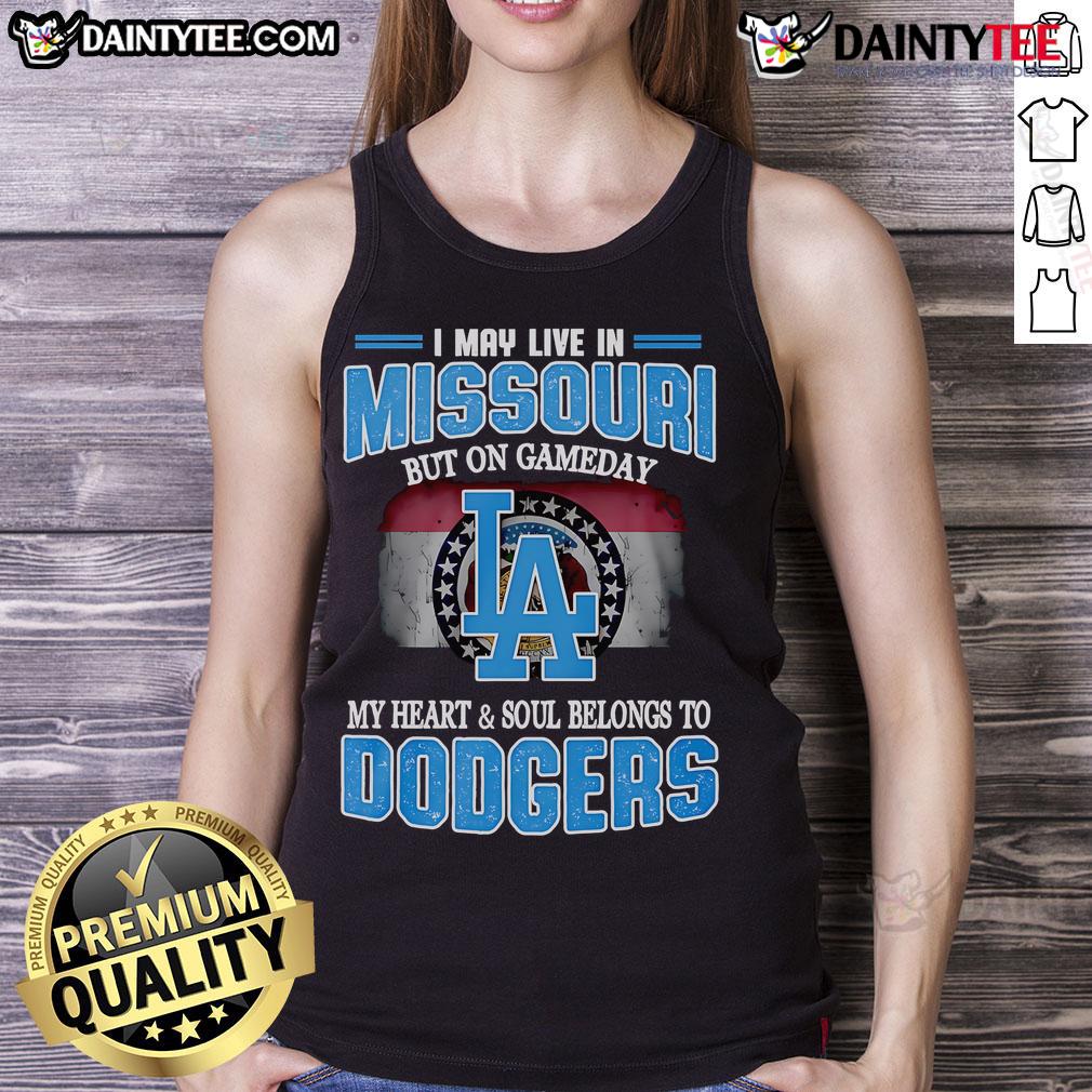 Alt Text: Woman wearing a Dodgers tank top, expressing love for the team on game day in Missouri.