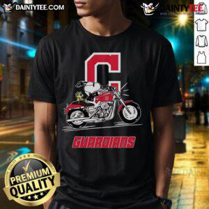 Good Snoopy and Woodstock riding a motorbike on a Cleveland Guardians T-shirt, vibrant cartoon design for fans.