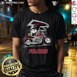 Happy Snoopy and Woodstock riding a motorbike on an Atlanta Falcons T-Shirt, perfect for fans and collectors.