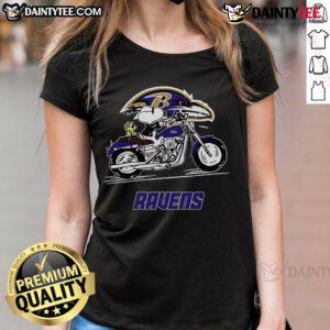 Happy Snoopy and Woodstock riding a motorbike in a Baltimore Ravens ladies tee, showcasing team spirit and fun.