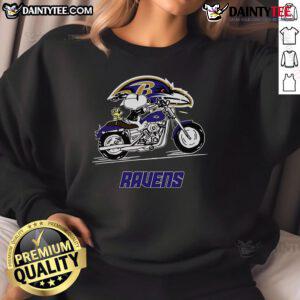 Alt Text: Happy Snoopy and Woodstock riding a motorbike in a Baltimore Ravens sweatshirt, showcasing playful team spirit.