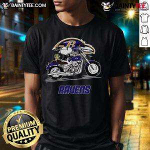 Happy Snoopy and Woodstock riding a motorbike on a Baltimore Ravens T-shirt, perfect for fans and collectors.