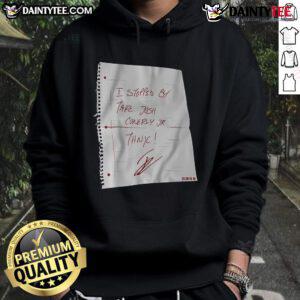 Josh Conerly Jr. wearing a 'Nice I Stopped By' hoodie, showcasing stylish streetwear in a vibrant urban setting.
