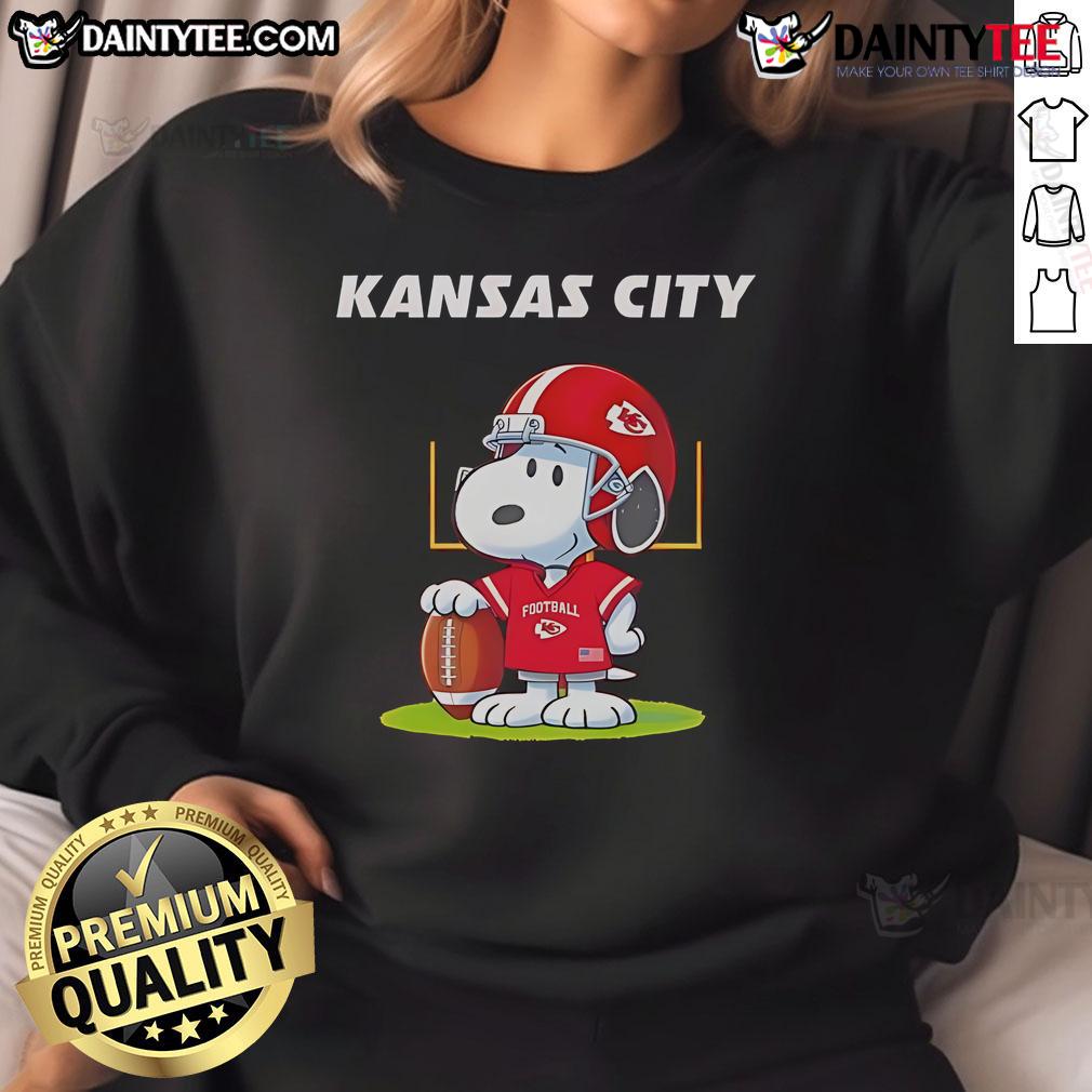 Alt Text: 2025 Nice Kansas City Chiefs X Peanuts Day sweatshirt featuring vibrant graphics and team logo for fans.