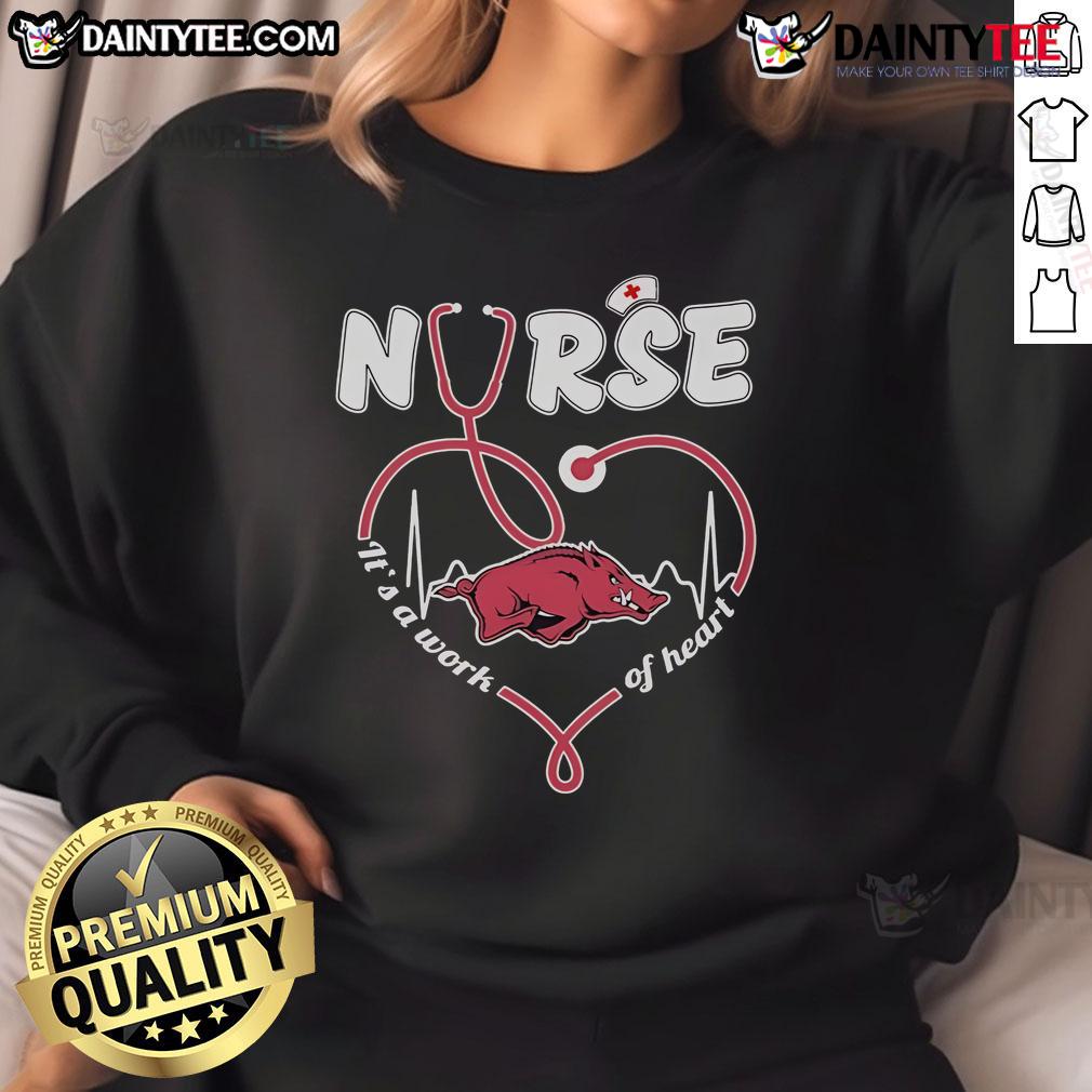 Alt Text: Official Arkansas Razorbacks Nurse sweatshirt featuring It's a Work of Heart design in vibrant team colors.