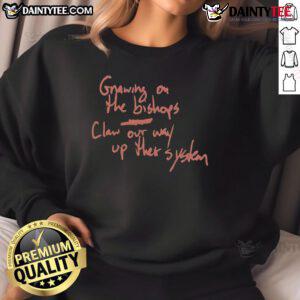 Alt Text: Official Gnawing On The Bishop's Claw sweatshirt featuring a bold design, perfect for fans of unique streetwear style.